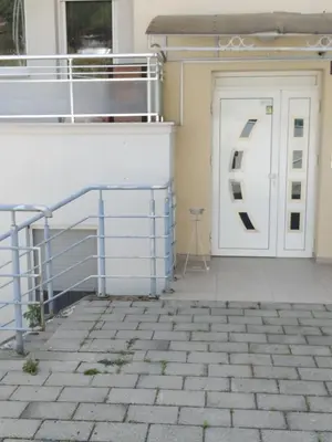 a door with a letter on the side of a building at Studio apartman BB4 in Vrnjačka Banja