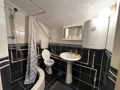 a small bathroom with a toilet and a sink at Studio x2 in Jošanička Banja