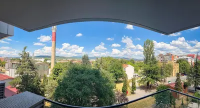a view of a city from a balcony at Elegant Escape Lux, Planet Residence i Spa center in Niš