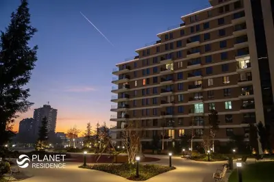 a large building in a city at night at Elegant Escape Lux, Planet Residence i Spa center in Niš