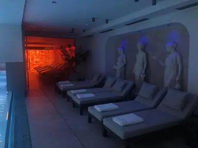 a living room with couches and a swimming pool at Elegant Escape Lux, Planet Residence i Spa center in Niš