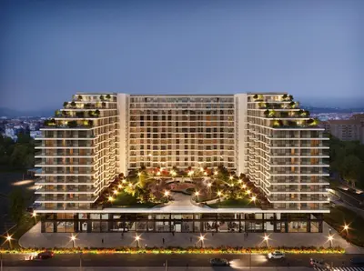 a large building with lights on it at night at Elegant Escape Lux, Planet Residence i Spa center in Niš