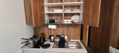 a kitchen with a sink and a counter top at Daisy Apart SKI OUT SKI IN Vila Bela Reka Brzece in Brzeće