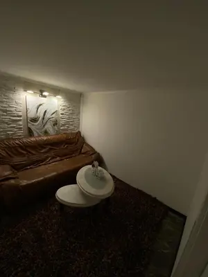 a living room with a couch and a coffee table at Diamona Lux Apartman 1 in Donja Toponica