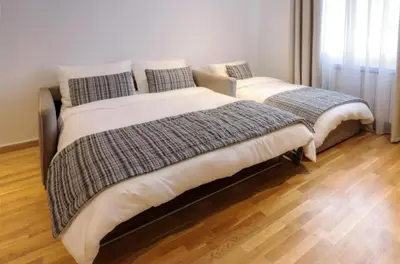 two beds sitting next to each other in a bedroom at Apartment Aleksandar AS in Brzeće