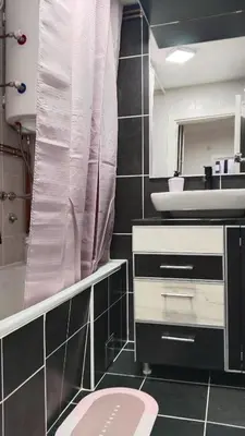 a bathroom with a pink toilet and a sink at Lela's home II in Knjazevac.