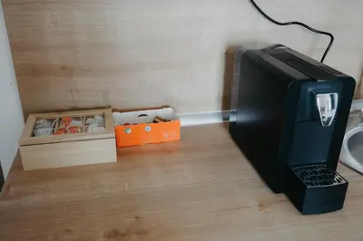 a computer monitor sitting on a desk with a box at SKY VIEW Apartment - Ski resort Kopaonik in Cajetina