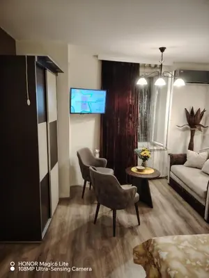 a living room with a couch and a table at Sunce in Ribarska Banja
