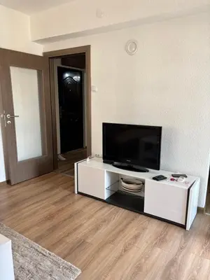 a living room with a flat screen tv on a table at Apartman A2 in Vrnjačka Banja