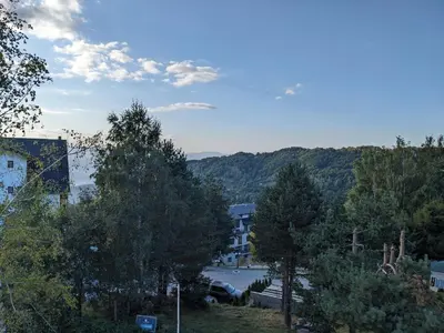 a view of a parking lot with trees and buildings at Silverpine, Kopaonik in Kopaonik