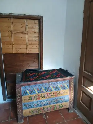a wooden box sitting on the floor in a room at KAMENICA Stara Planina in Dimitrovgrad