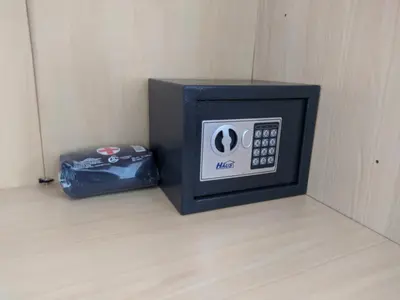 a microwave oven sitting on the floor next to a bag at Golden lady in Niš