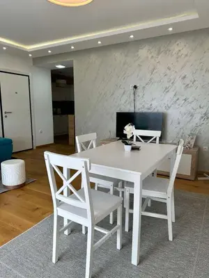 a white table and chairs in a living room at VIP House 4 in Vrnjačka Banja