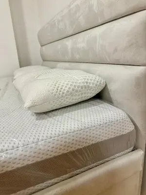 a bed with a pillow on top of it at Vidolux Studio - Free Garage and Fast WiFi in Niš