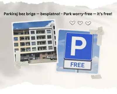a free sign in front of a building at Vidolux Studio - Free Garage and Fast WiFi in Niš