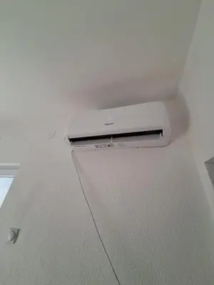 a laptop is sitting on top of a ceiling at Tomić
