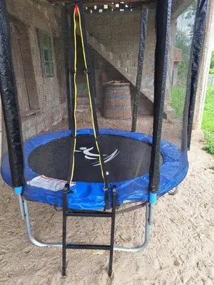 a batting cage with a net and a hoop at Tomić