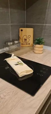 a table with a napkin on a counter with a bag at Residence Hill - Apartman B112A in Kopaonik