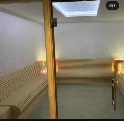 a glass door of a empty bench in a room at Residence Hill - Apartman B112A in Kopaonik