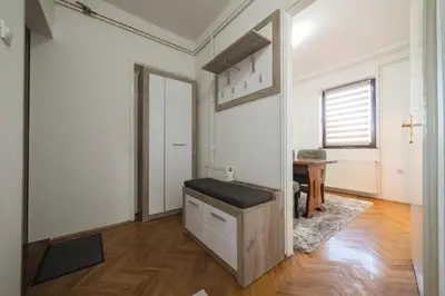 an empty room with a cross on the wall at Apartman ANJA LUX01 in Pirot