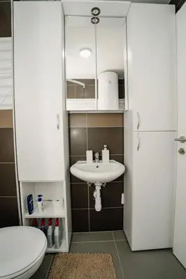 a bathroom with a sink and a toilet at Lilys LUX apartman in Vrnjačka Banja