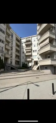 an empty parking lot in front of apartment buildings at Sofija apartmani in Paraćin