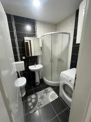 a bathroom with a shower and a toilet and a sink at Sofija apartmani in Paraćin