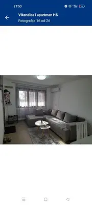 a living room with a couch and a table at Vikendica i apartman HS in Pirot