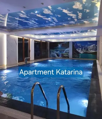 a swimming pool in a hotel with the words apartment katerina at Kopaonik,President kop Katarina free wellness&spa in Kopaonik