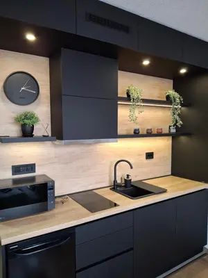 a kitchen with a sink and a clock on the wall at Kopaonik,President kop Katarina free wellness&spa in Kopaonik