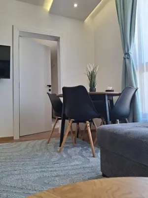 a living room with three chairs and a table at Kopaonik,President kop Katarina free wellness&spa in Kopaonik