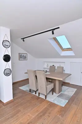 a dining room with a table and chairs at Lux&Spa Petko in Pirot