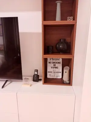 a shelf with a sign that says maybe no smoking no watching at Urban Elegance SPA Studio in Niš