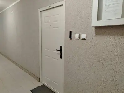 a white door in a room with a wall at WellNest Niš Self Check-in & Parking I Moderan, miran apartman plus radni kutak in Niš