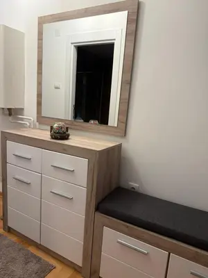a bathroom with a vanity with a mirror at Nest24- cozy apartment with terrace and private garage in Niš