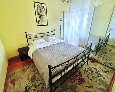 a bedroom with a bed and a window at City Fontana in Kruševac