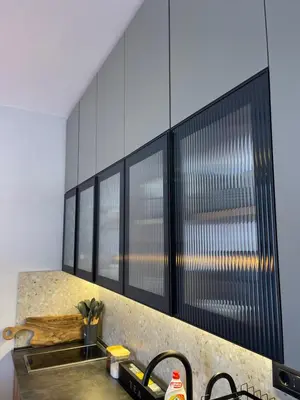 a kitchen with a sink and a bunch of windows at Evergreen Lux in Kopaonik