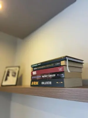 a stack of books sitting on a shelf at Evergreen Lux in Kopaonik