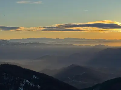 a view from the top of a mountain at sunset at Minalux i MInalux1 in Kopaonik