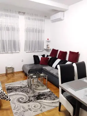 a living room with a couch and a table at Studio apartman BB4 in Vrnjačka Banja