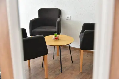 a meeting room with a table and two chairs at Apartman Sanja in Džavarci