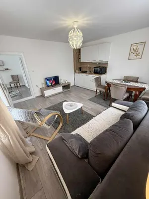 a living room with a couch and a table at Apartman MATEA in Pirot