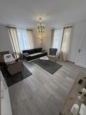 a living room with a couch and a table at Apartman MATEA in Pirot