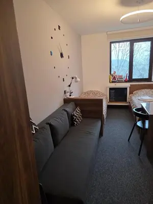 a living room with a couch and a table at Snow White apartman Vila Bela reka 50m from gondola - free parking in Brzeće