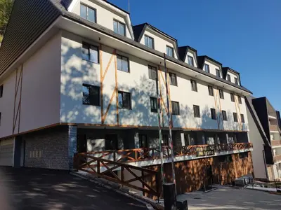 an exterior view of a building under construction at Snow White apartman Vila Bela reka 50m from gondola - free parking in Brzeće