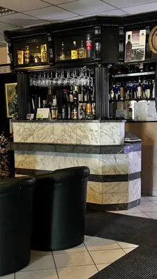 a bar in a restaurant with a marble counter at Motel Kruna in Despotovac