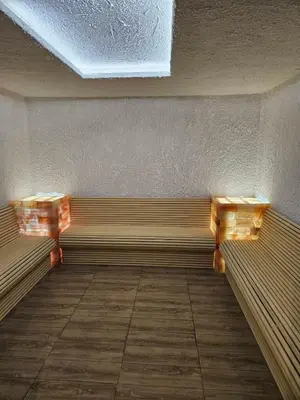 a empty bench in a room with a ceiling at UN lux - Residence Hill in Kopaonik