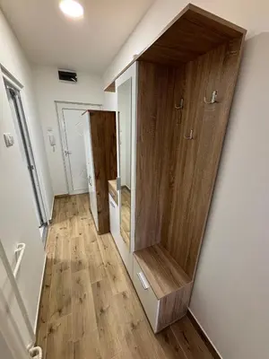 a hallway with wooden walls and wooden floors at Sweet home in Bor