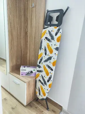 a tie with orange leaves on it next to a box at Sweet home in Bor