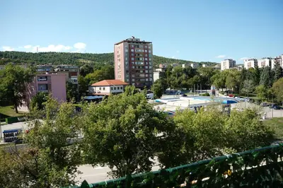 a view of a city with trees and buildings at Sweet home in Bor